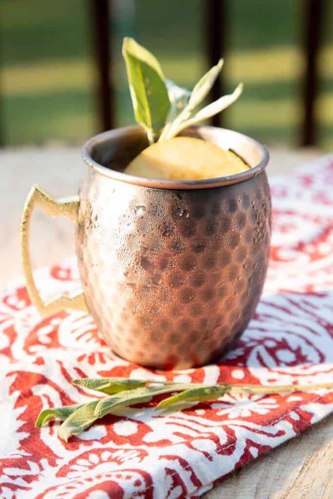 Apple cider Mule in a copper cup 