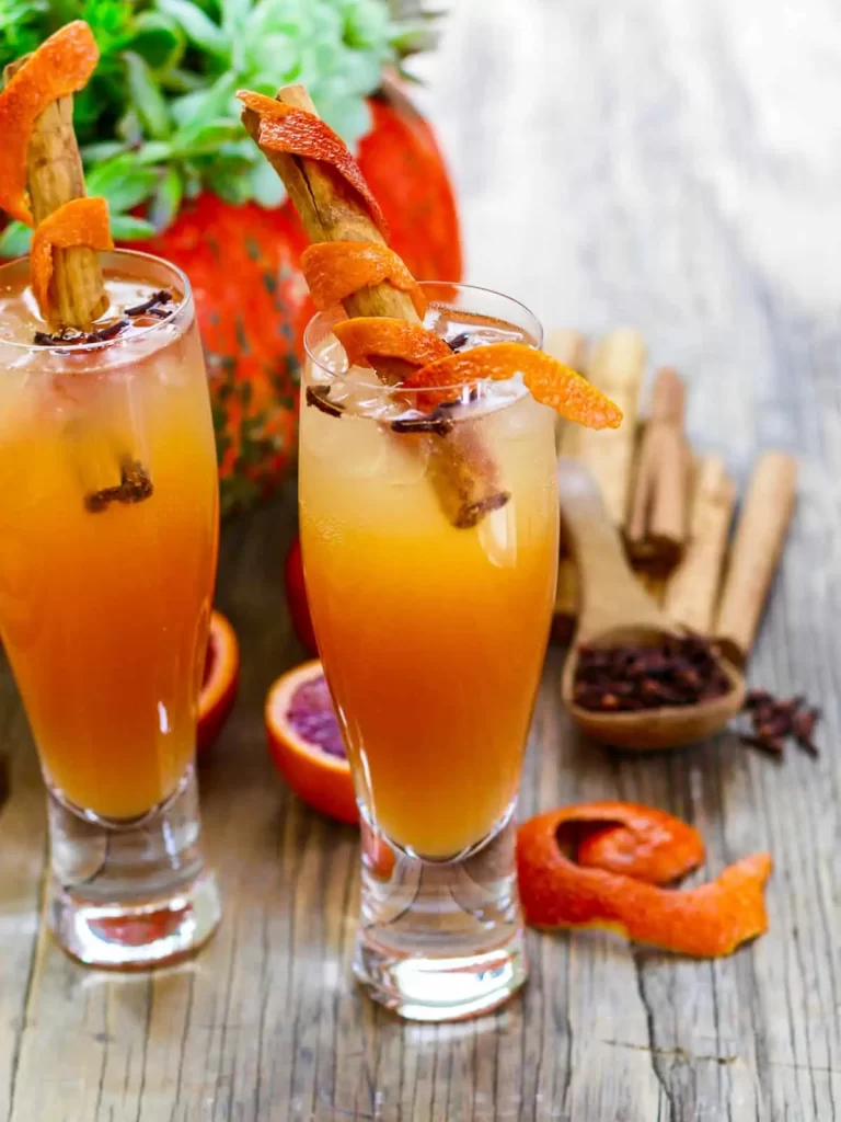Fireball Whisky Cocktail with an orange twist and cinnamon stick