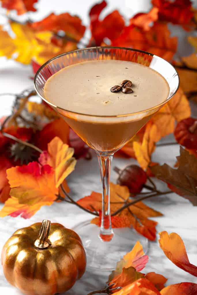 Pumpkin Spice Espresso Martini with fall leaves