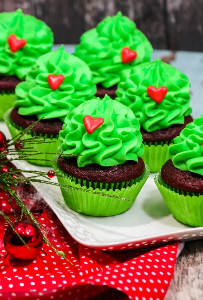 Grinch Cupckaes on a white platter
