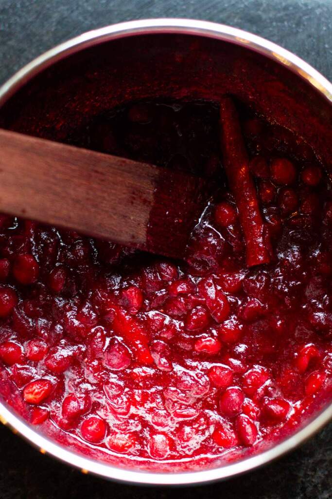 The Best homemade cranberry sauce cooked with cinnamon sticks and orange peel